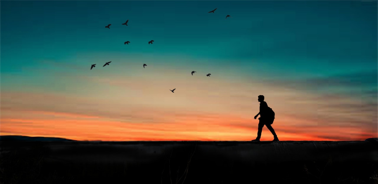 a walker walking during sunset